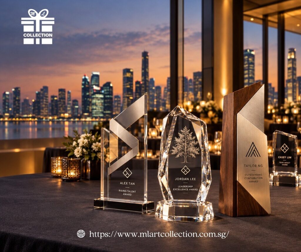 Premium customised trophies in crystal, acrylic and wood with engraved recipient names and logos, displayed at a Singapore awards event